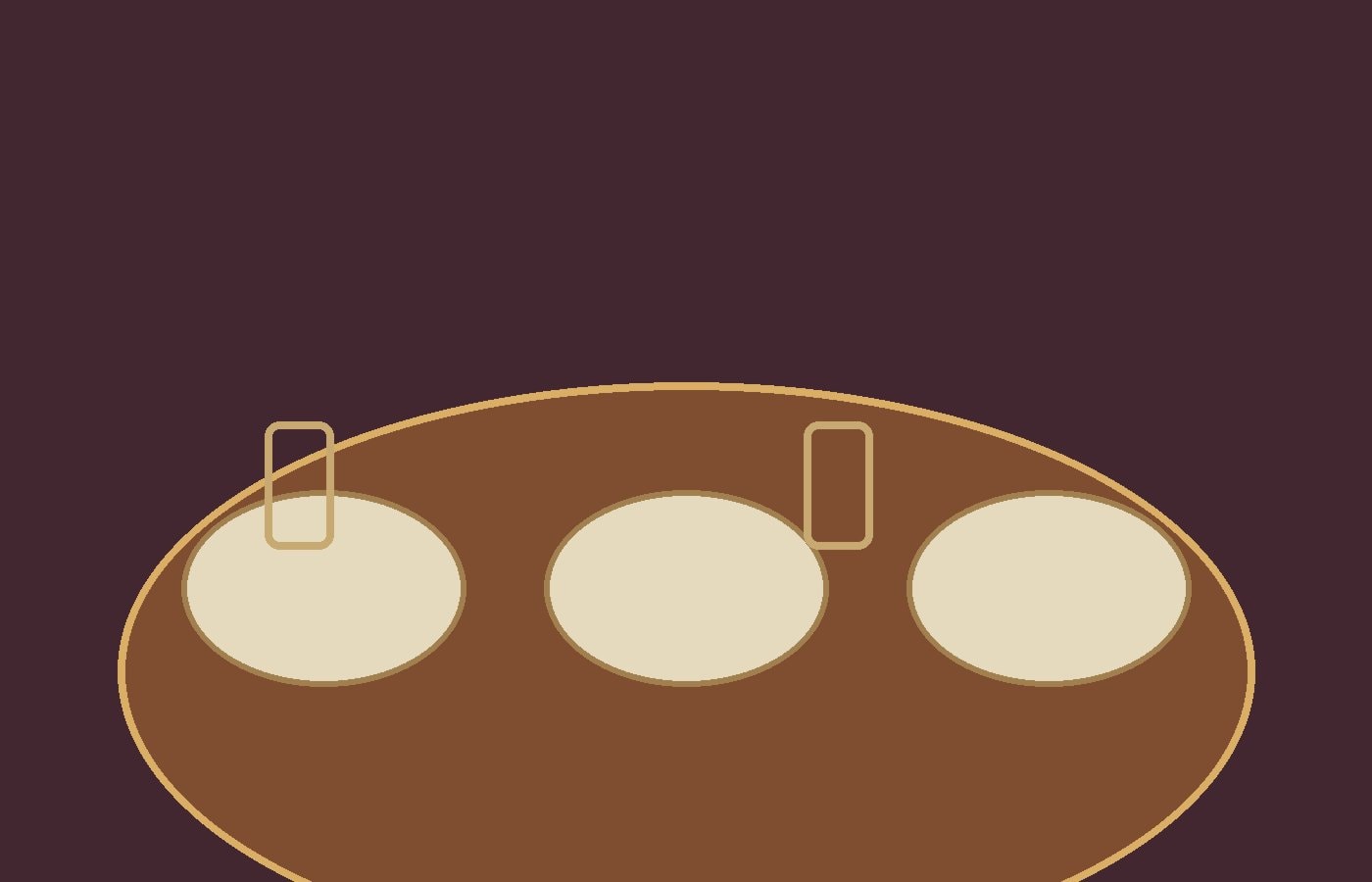 Empty dining table set with plain plates and folded cloth napkins under warm light